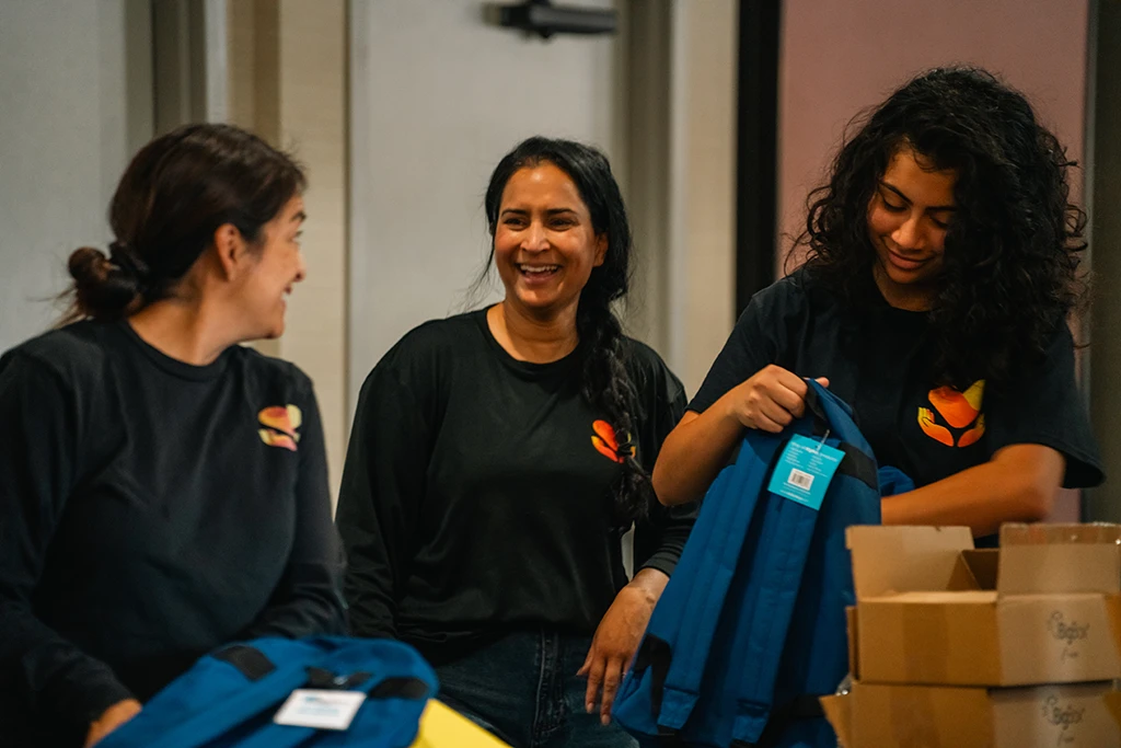 female volunteers packing supplies