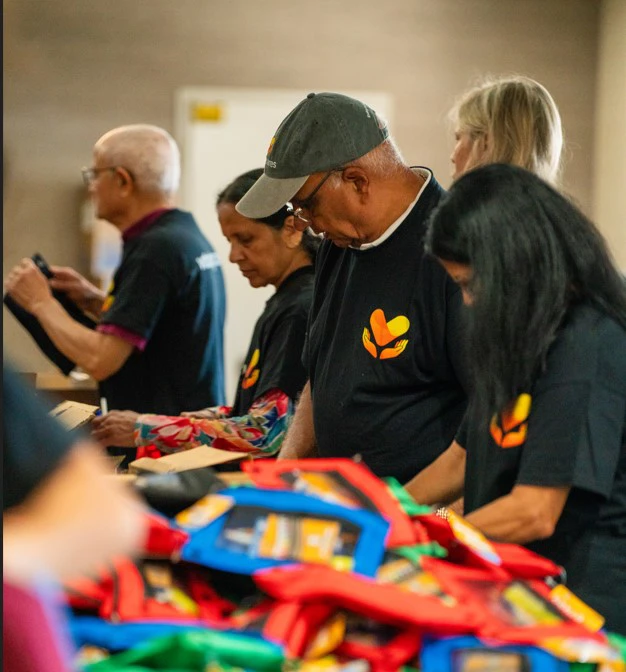 vituity care volunteers packing backpacks